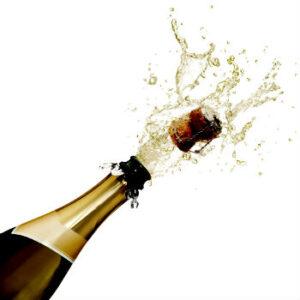 Cork popping out of a Champagne wine bottle